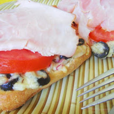 Hot Seasoned French Bread With Ham and Tomatoes