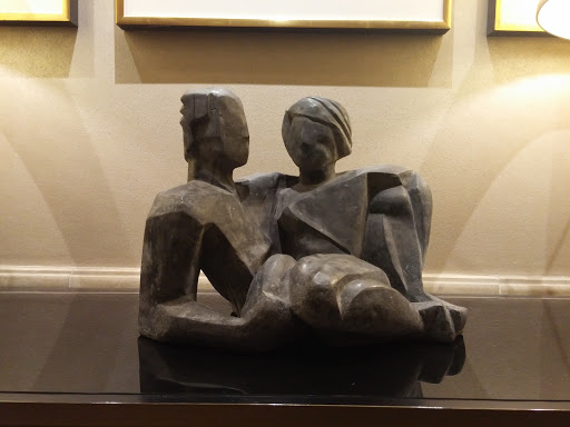 Man and Woman Relaxing Statue