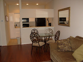 Living area, dining area, and kitchen from entry view