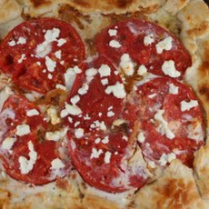 Tomato Galette with Goat Cheese, Caramelized Onions, and Bacon