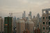 Daytime view facing east (towards Pudong) from my balcony. The Orient Pearl TV Tower is under the left side of the crane. The right edge of the crane points to the Jinmao Tower (tallest building in Shanghai) and the the right of that is the World Financial Center (soon to be the tallest building in Shanghai).