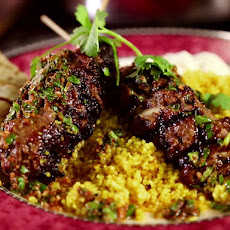 Moroccan Beef Kebabs with Curried Couscous, Raita and Charmoula Vinaigrette