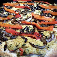 Hummus Pizza With Caramelized Onions and Roasted Red Peppers