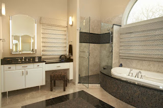 Deck mounted tub with river rock accents