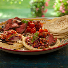 Open-Faced Pitas with Rotisserie Lamb with Pomegranate and Mint, Grilled Tomatoes, and Greek Slaw