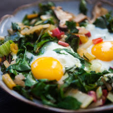 Eggs Nested in Sautéed Chard and Mushrooms