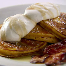 Orange Pumpkin Pancakes with Vanilla Whipped Cream, Cinnamon Maple Syrup and Thick-Cut Bacon