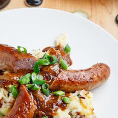Bangers and Colcannon with Guinness Onion Gravy