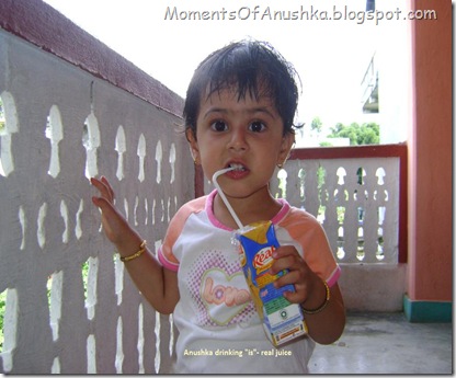 Anushka drinking juice