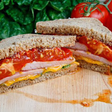 Peameal Bacon and Roasted Tomato Sandwich with Cheddar Cheese and Grainy Honey Mustard