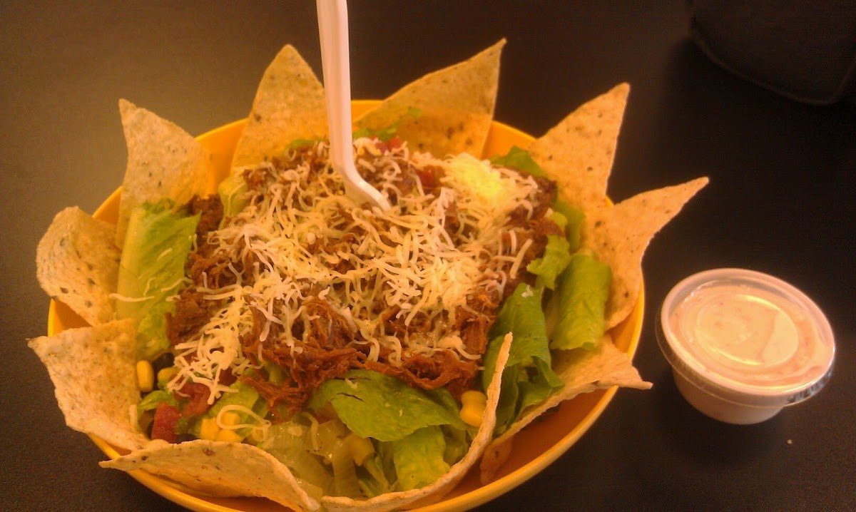 taco salad with shredded beef, sweet corn, black beans & cilantro salsa