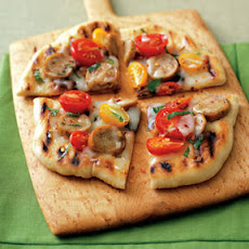 Pizza with Sausage, Tomatoes and Basil