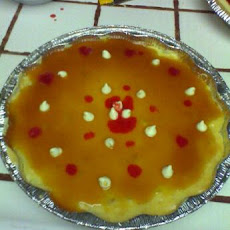 White Chocolate Macadamia Nut Cheesecake With Caramel and Raspbe