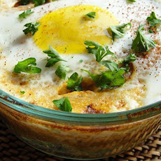 Baked Eggs over Roasted Tomatoes and Citrus Herb Couscous