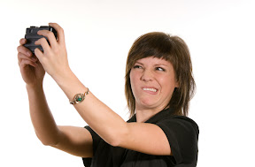Woman baffled by the prospect of buying a digital camera