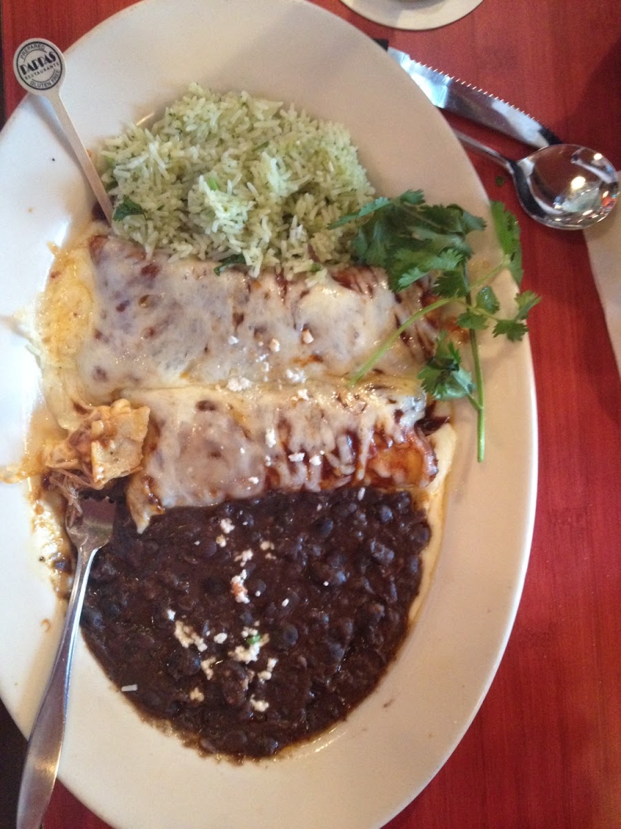 Beef brisket enchiladas with refried black beans and cilantro lime rice