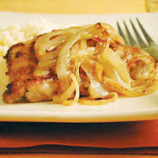 Smothered Pork Chops with Onions and Cheddar Grits