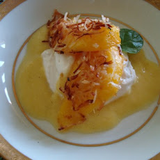 Coconut Crusted Mango Slices with Pineapple Sauce and Whipped Coconut Cream