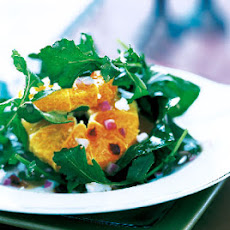 Arugula Salad With, Oranges, Pomegranate Seeds, and Goat Cheese
