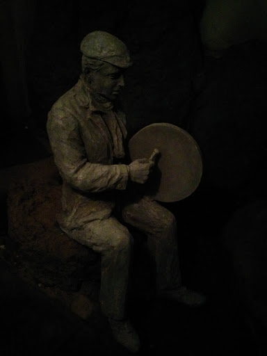 Statue Of A Gong Player