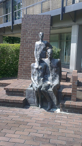 Three People Statues