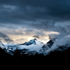Mountain in Glacier National Park by Joe Boyle - Landscapes Mountains & Hills ( clouds, mountain, fog, sunset, gnp, sunrise, glacier national park )