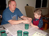 Alex helping Jay hold the egg holder.