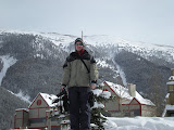 Josh on top of a snow mound.