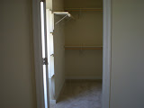 Walk-in closet with built in shelves.