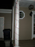 Red lights making a stripe around the columns.