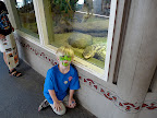 He poses with relatives! In this case, the Nile Monitor.