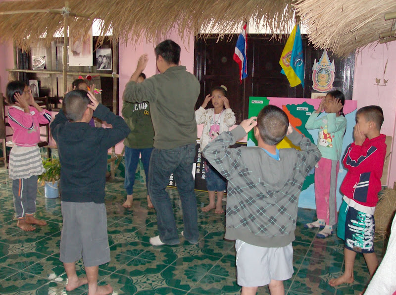 Volunteer Adrian educates through dance An introduction to Western game, Simon Says.
