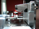 Side view of the Counterbore Precision Measurement Machine.  The slide and holding arm are in the part-loading position.