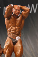 Male Bodybuilders Posing On Stage 3