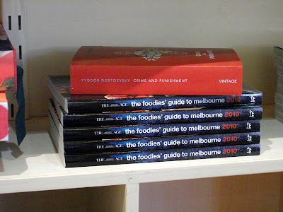 Dostoevsky's Crime and Punishment sits atop a pile of The Foodie's Guide To Melbourne 2010 - no comment