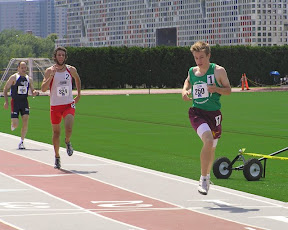 Middle-distance runner Scott Connolly charging hard though the finish line.