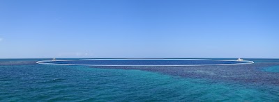 Same panorama shot, just with an overlay showing where the blue hole is in case you couldn't see it (apologies, but its really hard to get a photo of a submerged hole a hundred meters across from the deck of a boat only a couple meters above sea level..) bluehole2_1_overlay.jpg