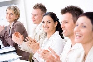 Clapping business people