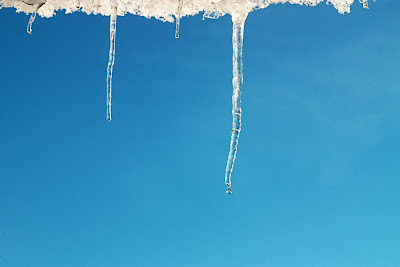 Free image of icicles against a blue sky