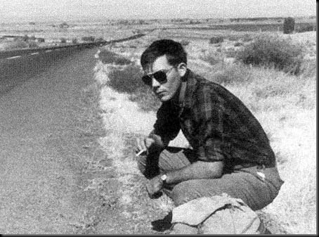 Hitching-Hunter-S-Thompson-crouching-by-road