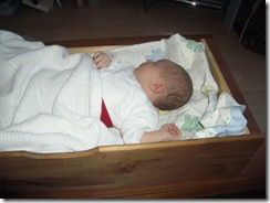 baby sleeping in drawer