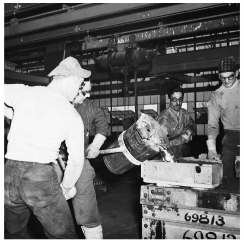 During World War II, magnesium was heavily used in aircraft components. In this 194 1 photo, workers pour molten magnesium into a cast at the Wright Aeronautical Corporation. 