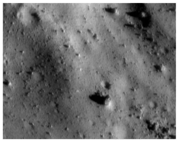 Close-up of near-Earth asteroid Eros as seen from the NEAR-Shoemaker cameras at a range of just 7 km. Most of the scene (about 350 meters across) is covered by rocks of all sizes and shapes, but the floors of some craters are smooth, suggesting accumulation of fine mobile material. The smallest visible features are about 1 meter across. (Image courtesy of NASA and the JHU Applied Physics Laboratory.) Source: /http:// photojournal.jpl.nasa.gov/cgi-bin/PIAGenCatalogPage.pl?PIA03118>.