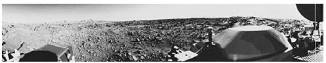 Figure 40. First panoramic view of Martian surface taking by Viking 1 Lander. The out-of-focus spacecraft component toward left center is the housing for the Viking sample arm, which is not yet deployed. Parallel lines faintly seen in the sky are an artifact and are not real features. However, the change of brightness from horizon toward zenith and toward the right (west) is accurately reflected in this picture, which was taken in the late Martian afternoon. At the horizon to the left is a plateaulike prominence much brighter than the foreground material between the rocks. The horizon features are approximately three kilometers (1.8 miles) away. At left is a collection of fine-grained material reminiscent of sand dunes. The dark sinous markings in the left foreground are of unknown origin. Some unidentified shapes can be perceived on the hilly eminence at the horizon toward left center of view. The horizontal cloud stratum can be made out halfway from the horizon to the top of the picture. At the center is seen the low-grain antenna for receipt of commands from earth. The projections on or near the horizon may represent the rims of distant impact craters. In the right foreground are color charts for Lander camera calibration, a mirror for the Viking magnetic properties experiment and pan of a grid on the top of the Lander body. At upper right is the high-gain dish antenna for direct communication between the landed spacecraft and earth. Toward the right edge is an array of smooth, finegrained material which shows some hint of ripple structure and may be the beginning of a large dune field off to the right of the view, which joins with dunes seen at the top left in this 300° panoramic view. Some of the rocks appear to be undercut on one side and partially buried by drifting sand on the other. 