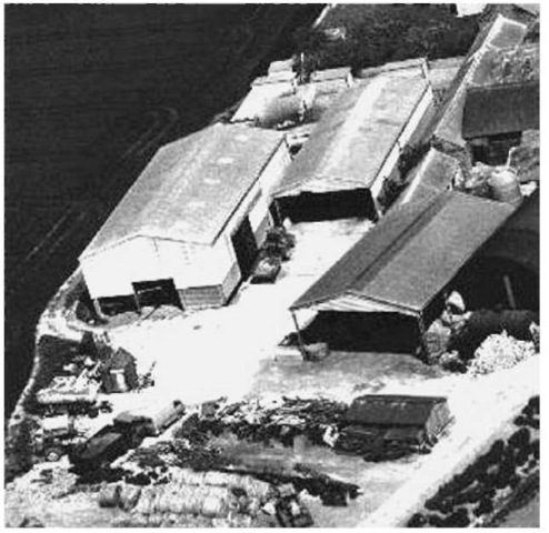 Scanned oblique photograph of farm buildings shown in Fig. 1.
