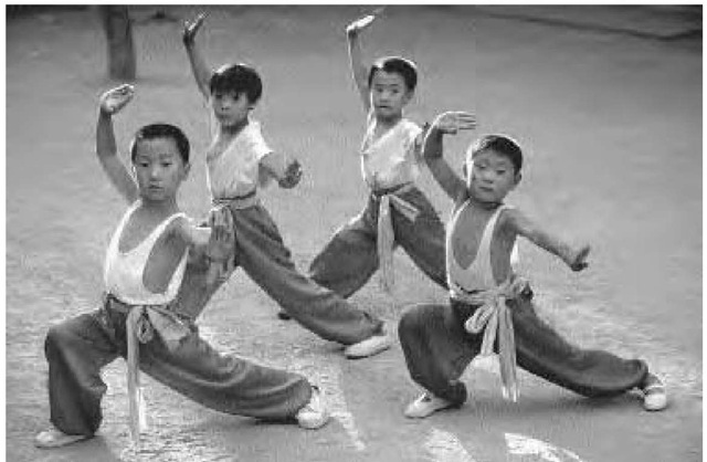 Young children in Beijing going through basic martial arts training, November 1997.