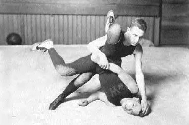 Two wrestlers at the University of Washington, ca. 1920. 
