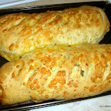 here is an example of the finished product, you can cook it at 350F and start checking the bread after about 25 minutes in the oven.  The internal temperature of bread/rolls should be 180F to 200F which may very if you have things like cheese in the center of the loaf.