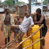  &ndash; Children with containers of water. June 2007 (James Mansaray, photography)