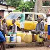  &ndash; People waiting in line for water during water shortage: June 2007 (James Mansaray, photographer)